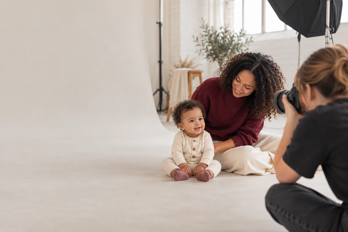 Baby and parent at a supervised modelling photo shoot