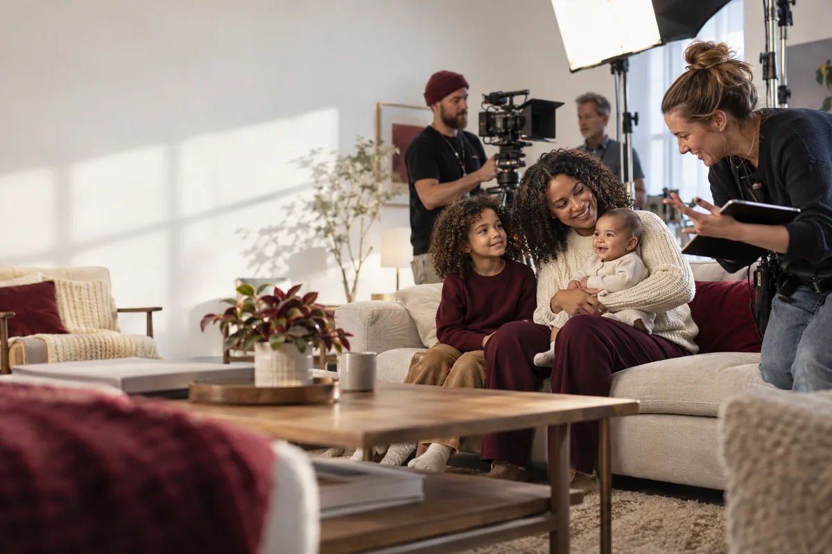 Parent and children with a professional production crew